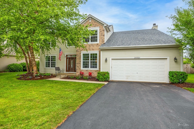 25321 Pastoral Dr, Plainfield, IL 60585 - view of front of house featuring asphalt driveway, brick siding, a front lawn, an attached garage, and a chimney