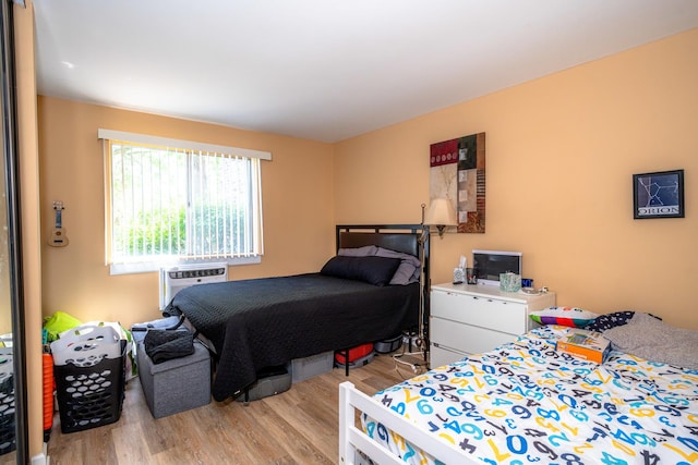 1461 N Winslowe Dr Unit 101, Palatine, IL 60074 - bedroom featuring wood finished floors and a wall mounted AC
