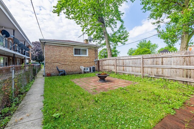 5124 W 32nd St, Cicero, IL 60804 - fenced backyard with a patio and an outdoor fire pit