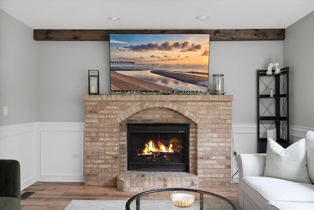 1297 Gregory Ct, Naperville, IL 60565 - living room with wainscoting, wood finished floors, a fireplace, beam ceiling, and recessed lighting