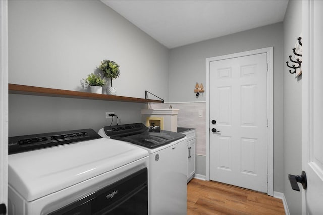 1297 Gregory Ct, Naperville, IL 60565 - laundry area featuring cabinet space, washer and clothes dryer, and light wood-type flooring