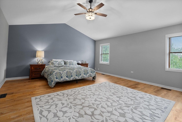 1297 Gregory Ct, Naperville, IL 60565 - bedroom with vaulted ceiling, a ceiling fan, and wood finished floors
