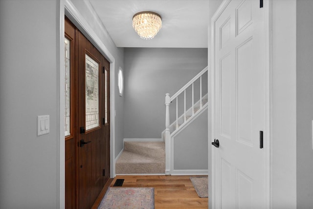 1297 Gregory Ct, Naperville, IL 60565 - entryway featuring a chandelier, light wood-style floors, and stairs