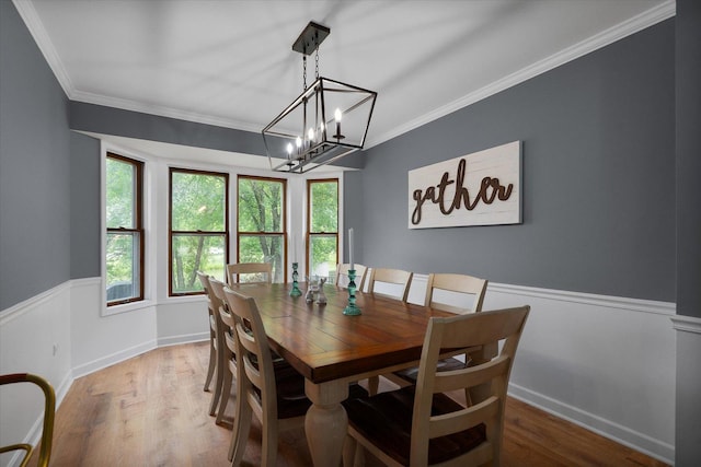 1297 Gregory Ct, Naperville, IL 60565 - dining room with crown molding, a wainscoted wall, a chandelier, and light wood-style floors