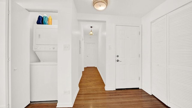 5150 S King Dr Unit A1, Chicago, IL 60615 - washroom featuring stacked washer / drying machine and wood finished floors