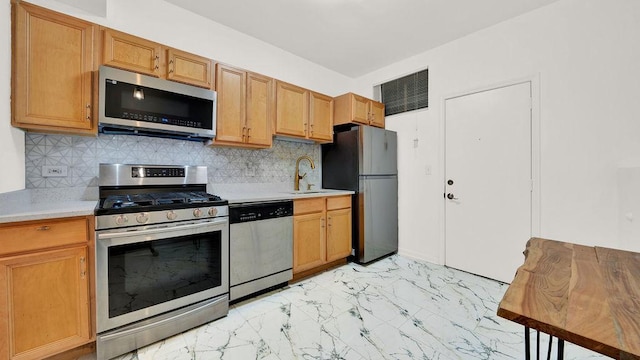 5150 S King Dr Unit A1, Chicago, IL 60615 - kitchen with appliances with stainless steel finishes, light countertops, light marble finish floors, and tasteful backsplash