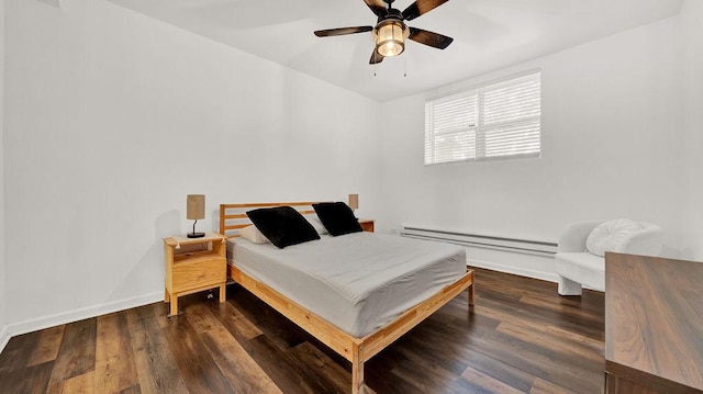 5150 S King Dr Unit A1, Chicago, IL 60615 - bedroom featuring a baseboard heating unit, wood finished floors, and a ceiling fan