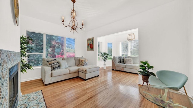 5150 S King Dr Unit A1, Chicago, IL 60615 - living room featuring a chandelier, light wood finished floors, and a fireplace with flush hearth