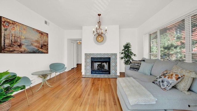 5150 S King Dr Unit A1, Chicago, IL 60615 - living area with a chandelier, hardwood / wood-style flooring, and a fireplace