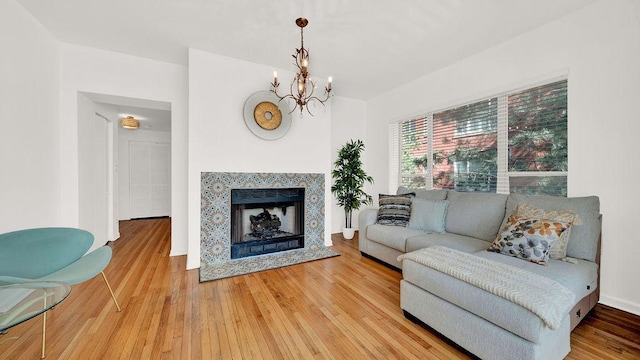 5150 S King Dr Unit A1, Chicago, IL 60615 - living area with a chandelier, light wood-style flooring, and a fireplace