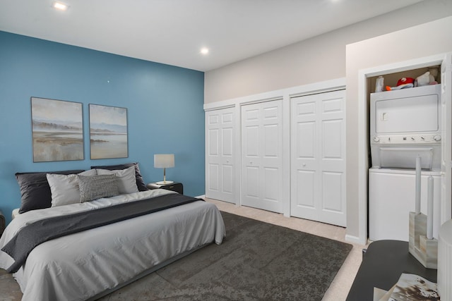 6021 Forest View Rd Unit 2C, Lisle, IL 60532 - carpeted bedroom with stacked washer / drying machine, two closets, and recessed lighting