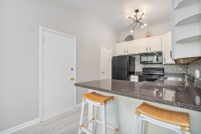 6021 Forest View Rd Unit 2C, Lisle, IL 60532 - kitchen featuring black appliances, open shelves, a peninsula, backsplash, and white cabinets