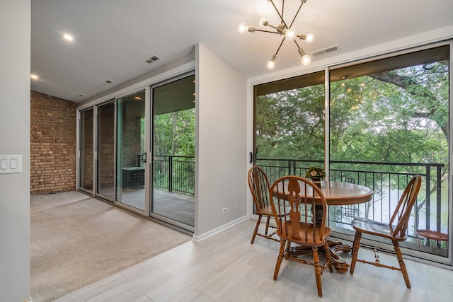 6021 Forest View Rd Unit 2C, Lisle, IL 60532 - sunroom with healthy amount of natural light and a chandelier