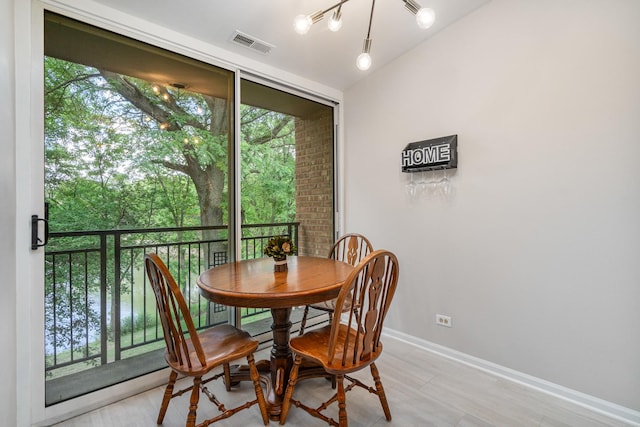 6021 Forest View Rd Unit 2C, Lisle, IL 60532 - dining area with healthy amount of natural light and floor to ceiling windows