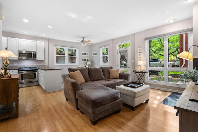 2809 N Wolcott Ave Unit H, Chicago, IL 60657 - living room featuring light wood finished floors, a ceiling fan, and recessed lighting