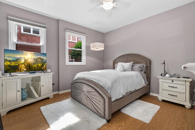2809 N Wolcott Ave Unit H, Chicago, IL 60657 - bedroom featuring light wood-style flooring and ceiling fan