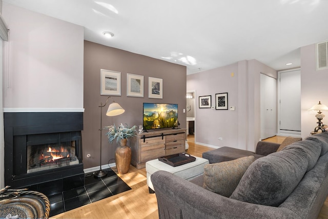 2809 N Wolcott Ave Unit H, Chicago, IL 60657 - living room with wood finished floors and a fireplace with flush hearth