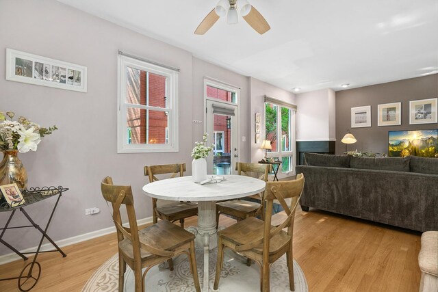 2809 N Wolcott Ave Unit H, Chicago, IL 60657 - dining space with light wood finished floors and ceiling fan