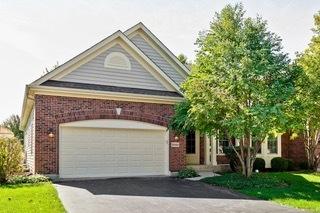 3942 Honeymoon Rdg, Lake In The Hills, IL 60156 - view of front facade featuring brick siding, asphalt driveway, and a garage