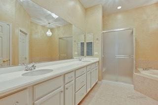 3942 Honeymoon Rdg, Lake In The Hills, IL 60156 - full bath featuring double vanity, an enclosed shower, a garden tub, and recessed lighting