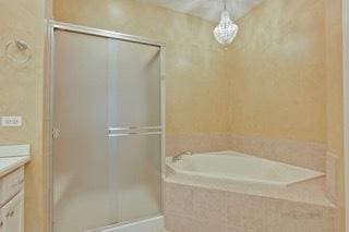 3942 Honeymoon Rdg, Lake In The Hills, IL 60156 - full bath with vanity, a shower stall, and a garden tub