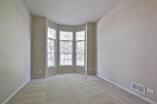 3942 Honeymoon Rdg, Lake In The Hills, IL 60156 - carpeted empty room featuring baseboards