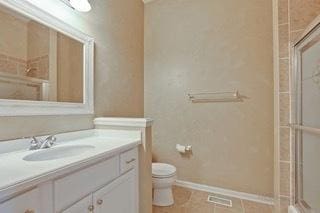3942 Honeymoon Rdg, Lake In The Hills, IL 60156 - bathroom featuring vanity, a shower with door, and tile patterned flooring