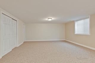 3942 Honeymoon Rdg, Lake In The Hills, IL 60156 - unfurnished bedroom featuring light colored carpet and baseboards
