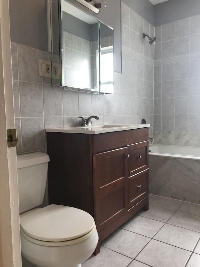 6457 N California Ave Unit 3, Chicago, IL 60645 - full bath with tile walls, tiled shower / bath, tile patterned floors, and vanity