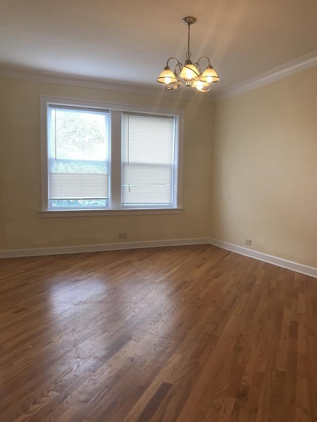 6457 N California Ave Unit 3, Chicago, IL 60645 - spare room with ornamental molding, a chandelier, wood finished floors, and healthy amount of natural light