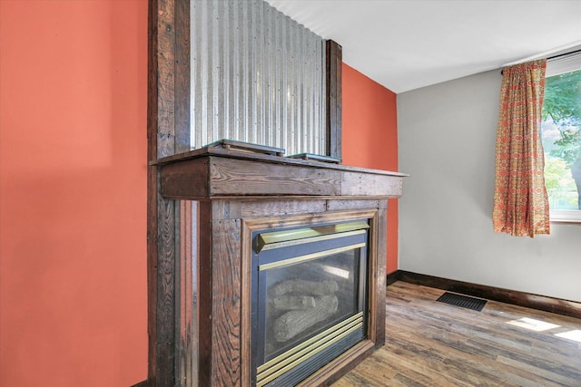 403 E Cooke St, Mount Pulaski, IL 62548 - detailed view of wood finished floors and a glass covered fireplace