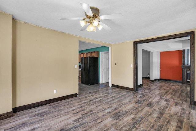 403 E Cooke St, Mount Pulaski, IL 62548 - spare room featuring wood finished floors and ceiling fan