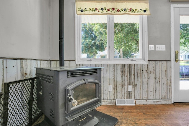 403 E Cooke St, Mount Pulaski, IL 62548 - detailed view of a wood stove, wood finished floors, and wood walls