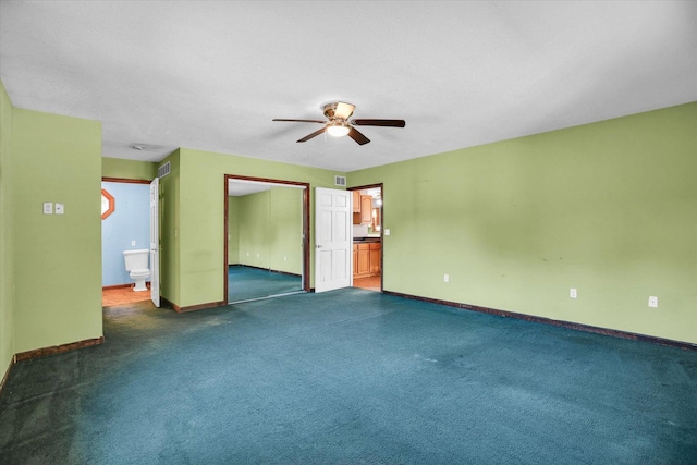 403 E Cooke St, Mount Pulaski, IL 62548 - carpeted empty room with a ceiling fan and baseboards
