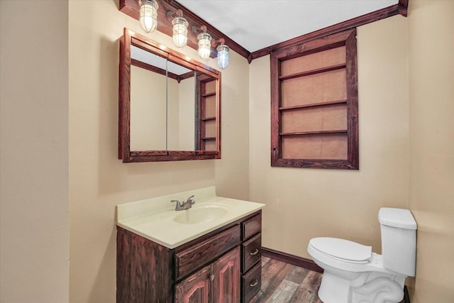 403 E Cooke St, Mount Pulaski, IL 62548 - half bathroom with vanity, wood finished floors, and ornamental molding