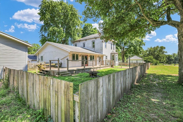 403 E Cooke St, Mount Pulaski, IL 62548 - back of property featuring a deck