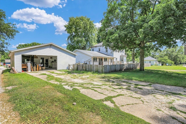 403 E Cooke St, Mount Pulaski, IL 62548 - view of yard with an outdoor structure, a detached garage, and a pole building