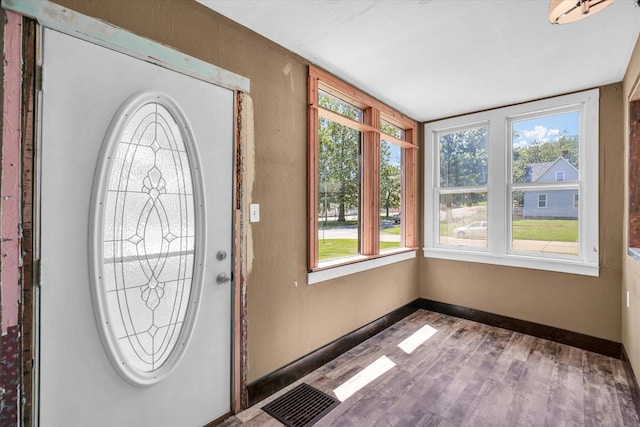 403 E Cooke St, Mount Pulaski, IL 62548 - entryway with healthy amount of natural light and wood finished floors