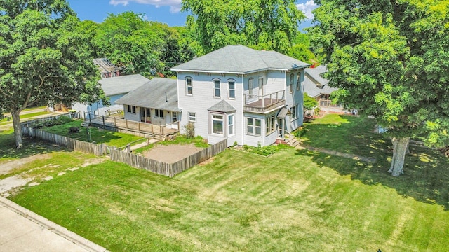 403 E Cooke St, Mount Pulaski, IL 62548 - rear view of house featuring a balcony and a shingled roof