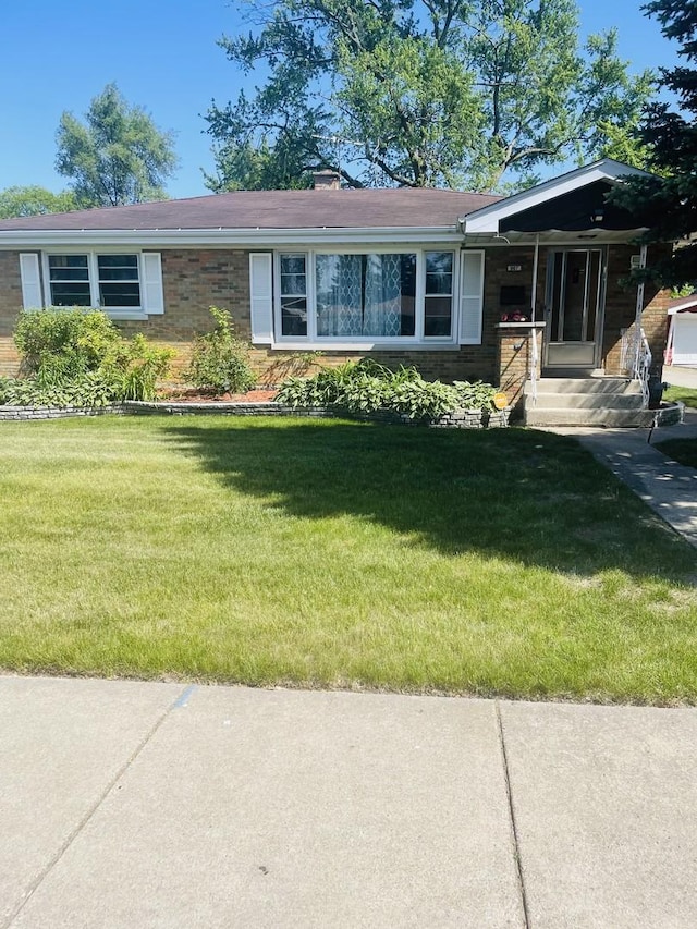 907 E 162nd Pl, South Holland, IL 60473 - view of front facade featuring a front yard and a chimney