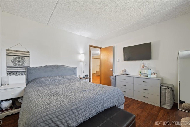 1050 N Farnsworth Ave Unit 202, Aurora, IL 60505 - bedroom with dark wood-style floors and a textured ceiling