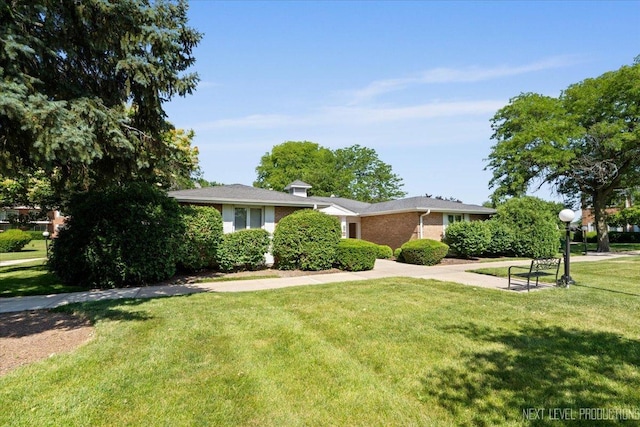 1050 N Farnsworth Ave Unit 202, Aurora, IL 60505 - view of front of property with a front yard and brick siding
