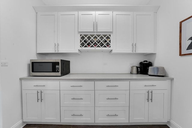 228 Juneway Ter, Lake Bluff, IL 60044 - kitchen featuring stainless steel microwave, white cabinets, and light countertops