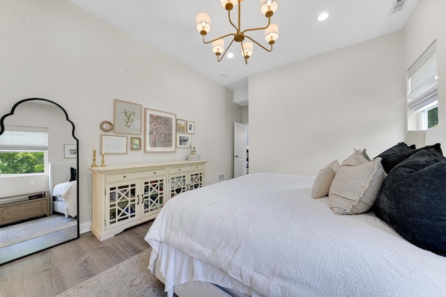 228 Juneway Ter, Lake Bluff, IL 60044 - bedroom with wood finished floors, multiple windows, a chandelier, and recessed lighting
