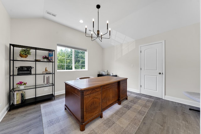 228 Juneway Ter, Lake Bluff, IL 60044 - home office featuring lofted ceiling, wood finished floors, and a chandelier