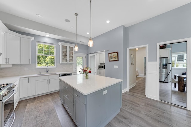 228 Juneway Ter, Lake Bluff, IL 60044 - kitchen featuring appliances with stainless steel finishes, white cabinets, light wood-type flooring, and recessed lighting