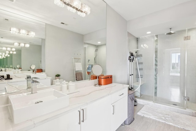 650 N Morgan St Unit 303, Chicago, IL 60642 - bathroom with a stall shower and vanity