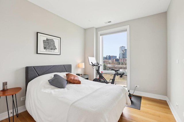 650 N Morgan St Unit 303, Chicago, IL 60642 - bedroom with wood finished floors and a city view