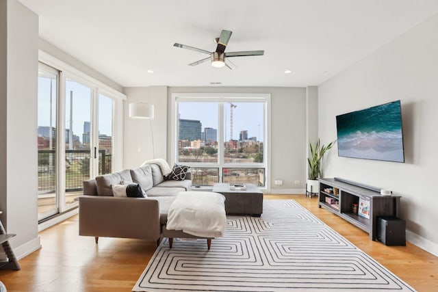 650 N Morgan St Unit 303, Chicago, IL 60642 - living area featuring a skyline view, light wood-style flooring, ceiling fan, and recessed lighting