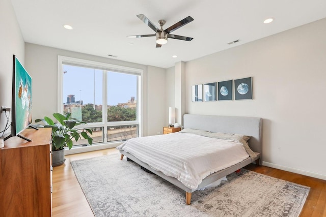 650 N Morgan St Unit 303, Chicago, IL 60642 - bedroom featuring wood finished floors, a ceiling fan, and recessed lighting